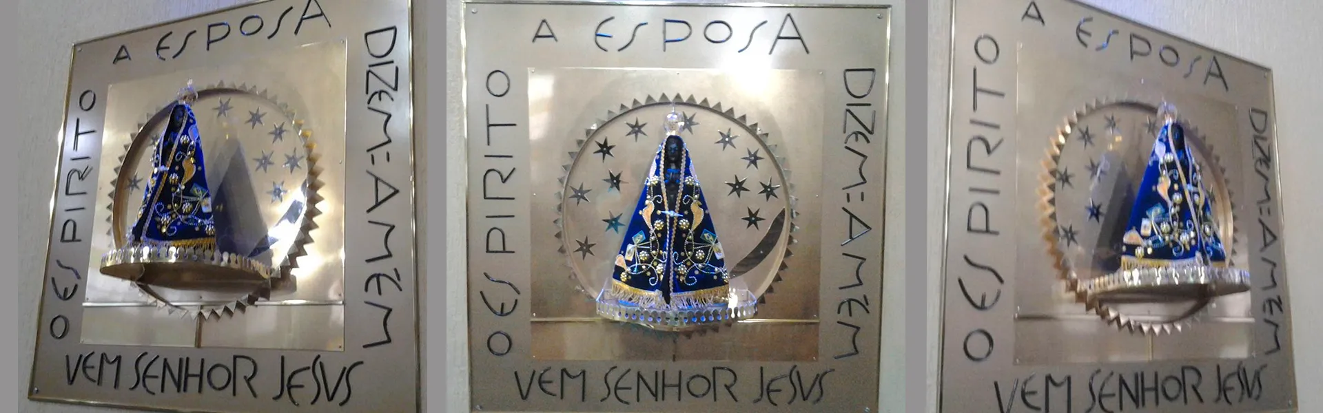 Nicho de Nossa Senhora Aparecida em metal, com a inscrição "O Espírito e a Esposa dizem: Amém. Vem, Senhor Jesus"
